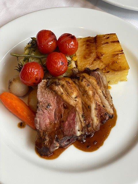 Steak dish presented on a plate from Gloucester Hotel